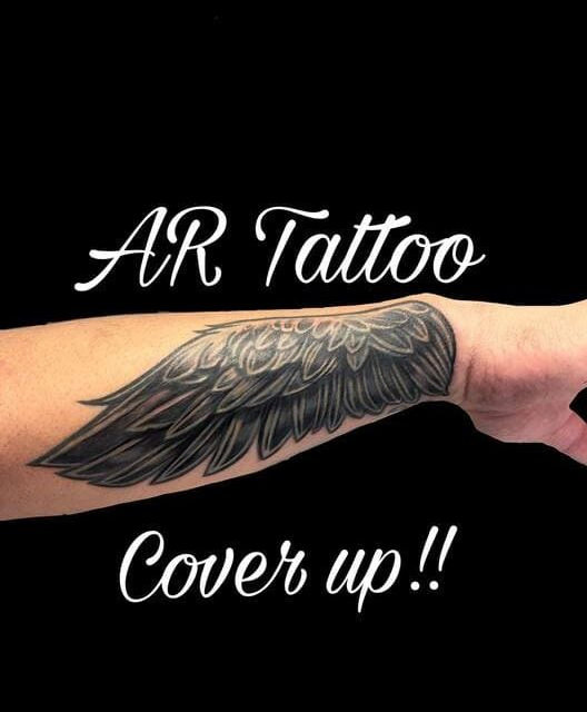 Cover de tatuaje antiguo con alas